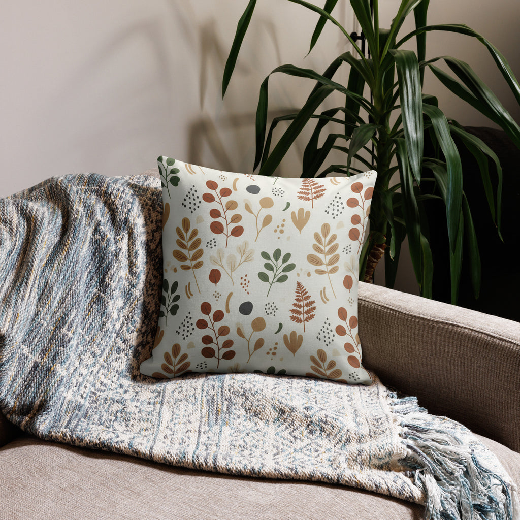 Nordic botanical throw pillow with eucalyptus and fern pattern on modern beige sofa - Scandinavian home decor