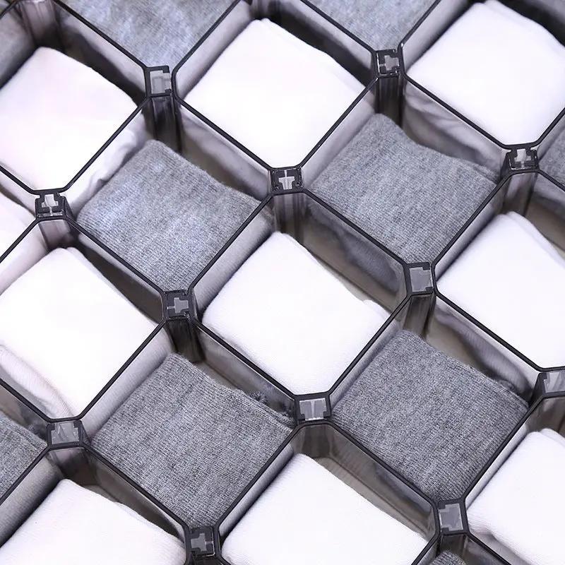 Close-up of compartments in honeycomb drawer organizer