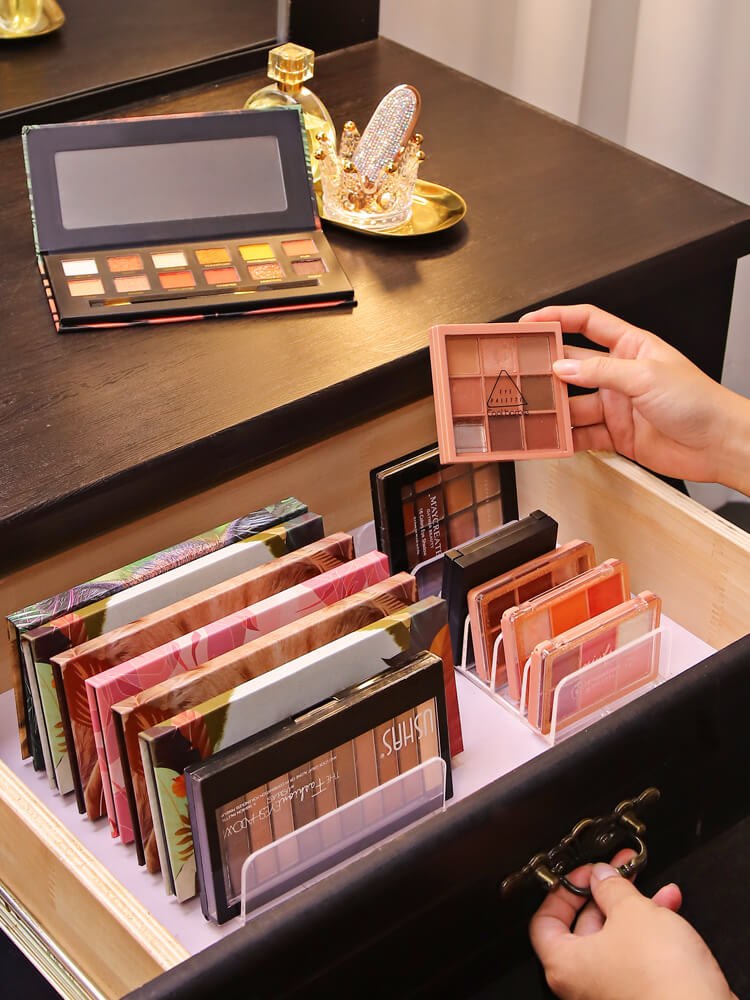 Front view of makeup organizer box with eyeshadow, blush, powder