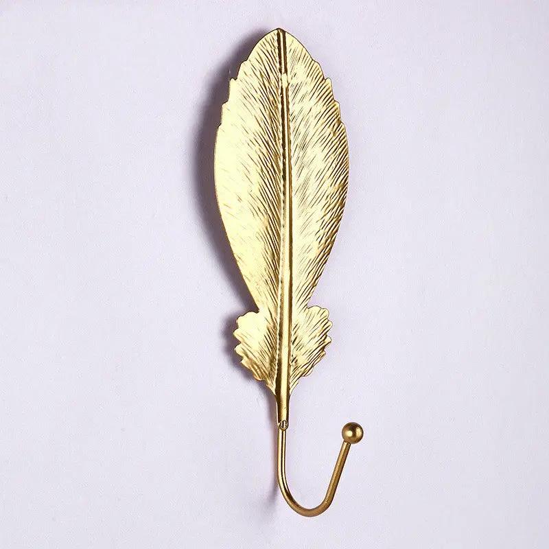 Front view of  a gold camellia leaf modern Nordic wall key holder