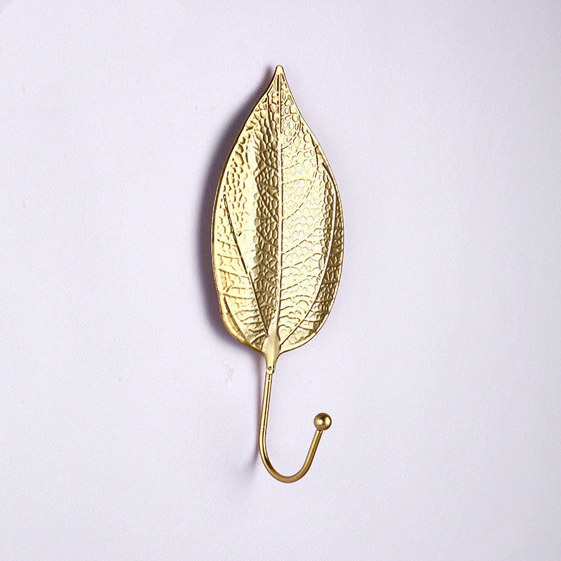 Front view of modern gold Nordic wall key holder